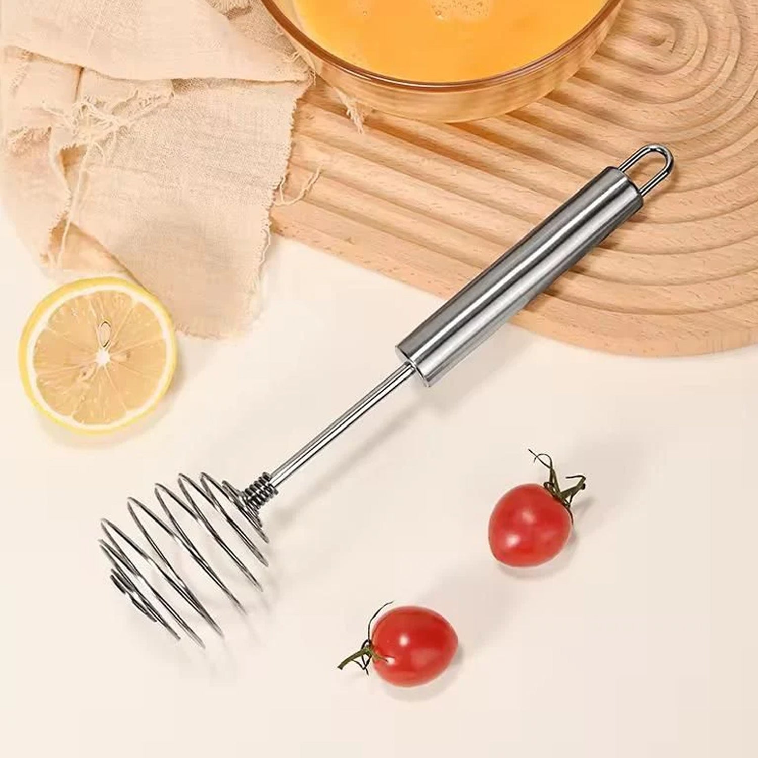 Egg beater whisk whipping ingredients in kitchen