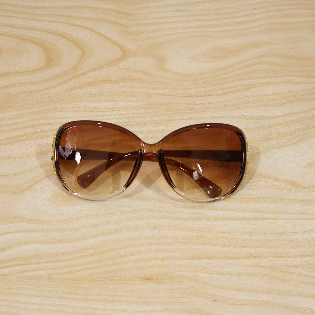 Detailed view of oversized sunglasses' frame and temple design.