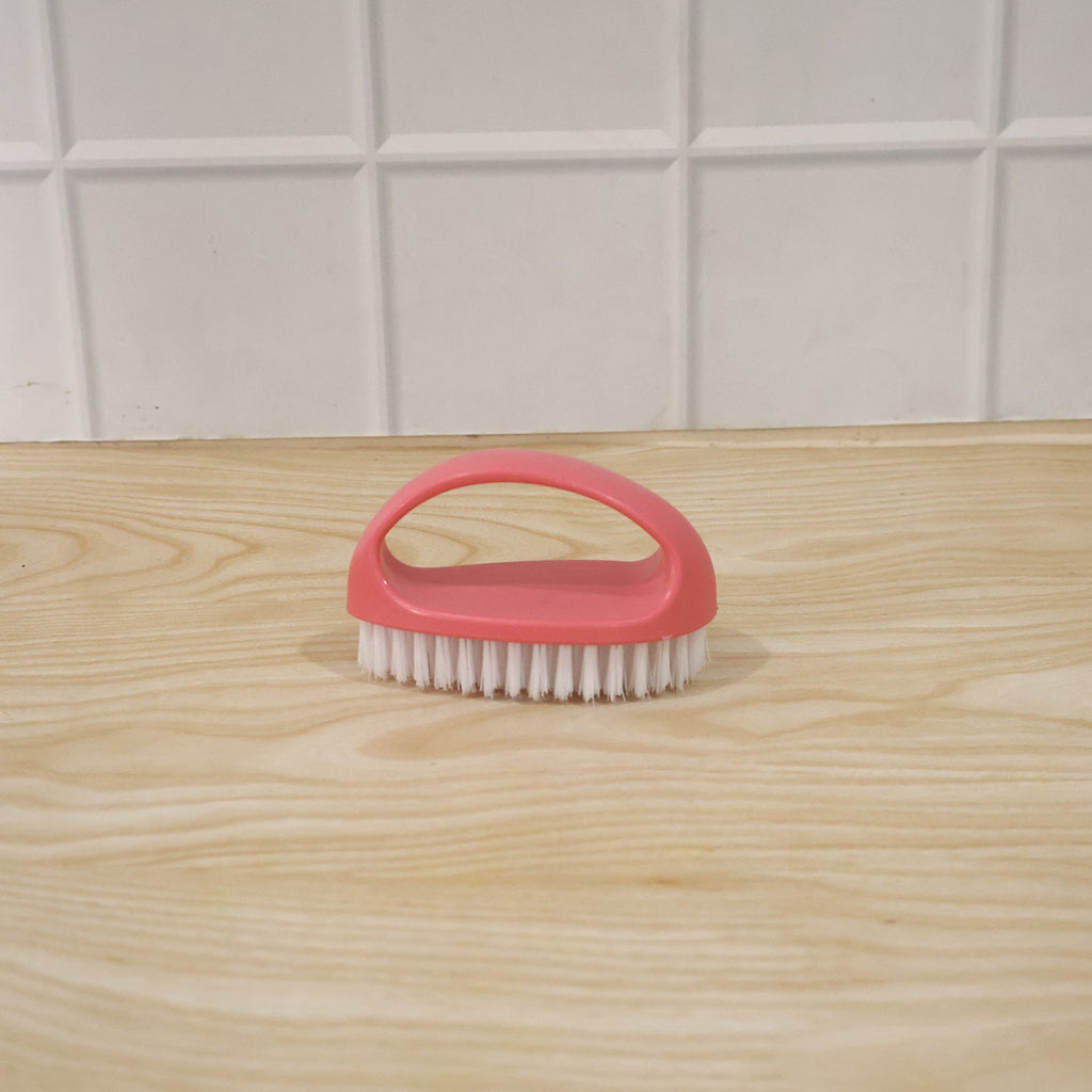 Person using multi-purpose cleaning brush on surface for deep cleaning
