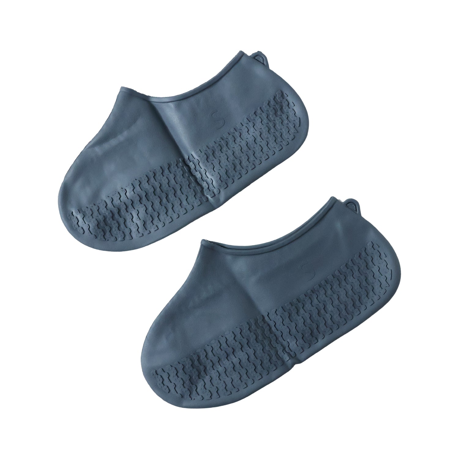 A pair of navy blue silicone shoe covers are displayed flat, showing their textured soles and smooth tops.